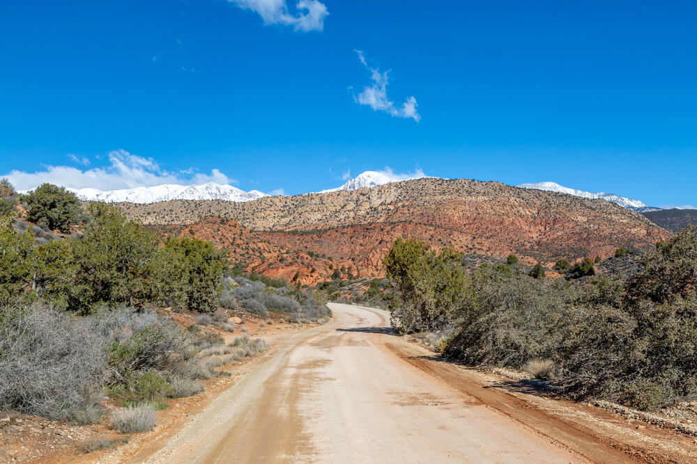 A desert road offers beautiful views for visitors and photographers at Silver Reef Ghost Town.